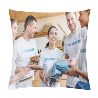 Personality  Five Young Multicultural Volunteers Talking While Holding Clothes In Charity Center Pillow Covers