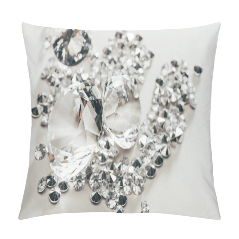 Personality  selective focus of transparent pure big diamonds among small on white background pillow covers