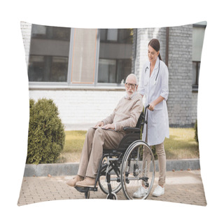 Personality  Smiling Social Worker Walking With Disabled Man In Wheelchair Outdoors Pillow Covers