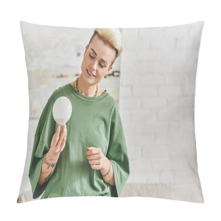 Personality  Cheerful Young Woman In Casual Clothes Looking At Energy Saving Light Bulb At Home, Trendy Hairstyle, Tattoo, Positive Emotion, Sustainable Lifestyle And Environmentally Conscious Concept Pillow Covers