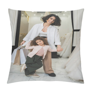 Personality  Happy Middle Eastern Woman With Brunette Hair Holding Shopping Bags And Hands Of Cute Little Girl While Standing Near Wedding Dresses In Bridal Salon, Mother And Daughter, Bridal Shopping  Pillow Covers