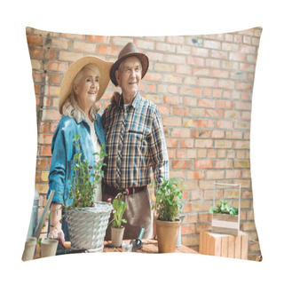 Personality  Senior Woman In Straw Hat Standing With Husband Near Green Plants Pillow Covers