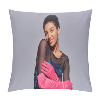 Personality  Smiling And Trendy African American Model In Cocktail Dress And Pink Gloves Touching Arm And Looking At Camera While Posing Isolated On Grey, Modern Generation Z Fashion Concept Pillow Covers