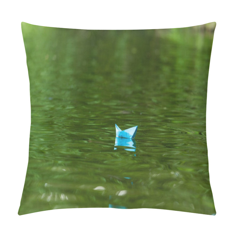 Personality  close-up shot of blue paper origami boat floating on water surface pillow covers