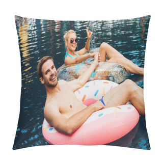 Personality  Smiling Couple Holding Hands While Lying On Swim Rings In Swimming Pool Pillow Covers