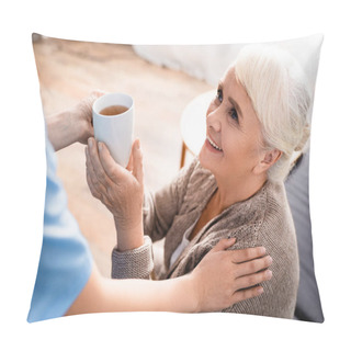 Personality  Smiling Senior Woman Taking Cup Of Tea From Nurse On Blurred Foreground Pillow Covers