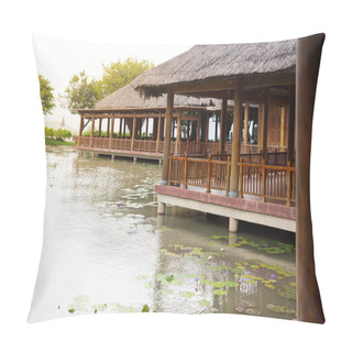 Personality  Traditional Vietnamese Wooden Houses On Concrete Pillar Foundation, Palm Leaves Thatched Roofing, Raised Up On Stilts Above Pond With Blossom Violet Water Lily Flower, Garden Mountain Background. Asia Pillow Covers