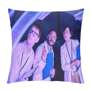Personality  Futuristic Exploration: Diverse-Age Scientists Investigate Device In Neon-Lit Science Center Pillow Covers