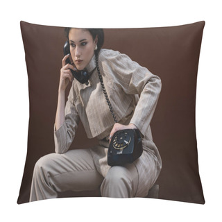 Personality  Trendy Model With Handset In Hand Sitting On Brown Background ,looking Away Pillow Covers