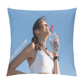 Personality  Low Angle View Of Cheerful Woman In Wireless Earphone Holding Bottle With Water Against Blue Sky Pillow Covers