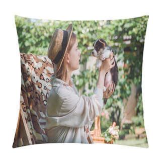 Personality  Side View Of Blonde Girl In Straw Hat Holding Puppy While Sitting In Deck Chair In Garden Pillow Covers
