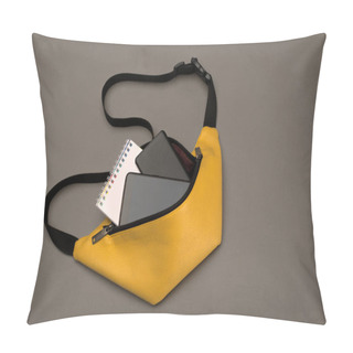 Personality  Yellow Belt Bag For Women And Men On A Dark Gray Background With Accessories: Notepad, Power Bank And Phone. Copy Space. Top View. Trend Colour 2021, Pantone. Pillow Covers