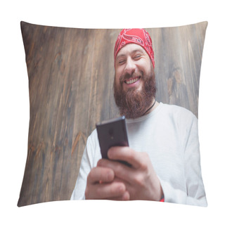 Personality  Funny News. Young Laughing Bearded Man  Holding Smartphone Against Wooden Wall. Pillow Covers