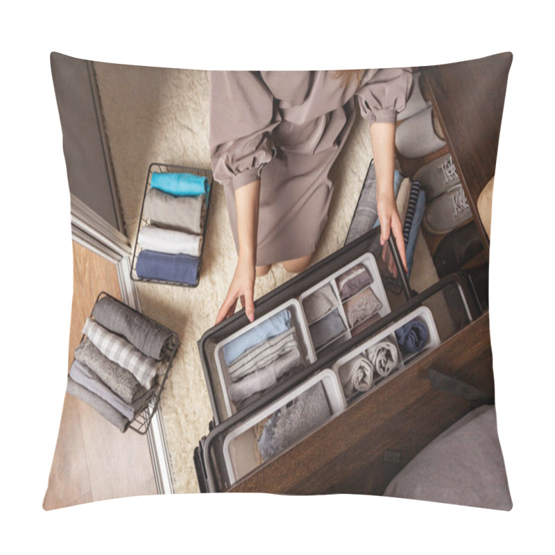 Personality  Housewife hands with neatly put underwear, clothes and accessories modern wardrobe organization pillow covers