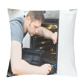 Personality  Professional Handyman In Overalls Repairing Domestic Oven In The Kitchen. Pillow Covers