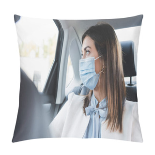 Personality  Stylish Woman In Medical Mask Looking Out Window While Sitting On Back Seat Of Car On Blurred Background Pillow Covers