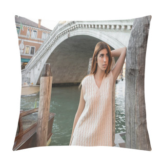 Personality  Woman In Sleeveless Shirt Leaning On Wooden Piling Near Venetian Bridge On Background Pillow Covers