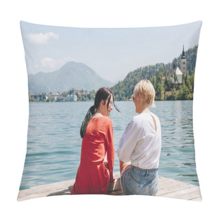 Personality  Back View Of Stylish Girls Sitting On Wooden Pier Near Tranquil Mountain Lake, Bled, Slovenia Pillow Covers