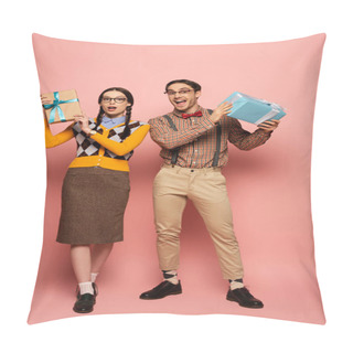 Personality  Couple Of Shocked Nerds Holding Gift Boxes On Pink Pillow Covers