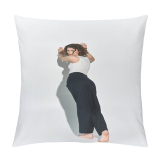 Personality  A Pretty Young Woman In Black Pants And A White Tank Top Confidently Poses In Front Of A Stark White Wall In A Studio Setting. Pillow Covers