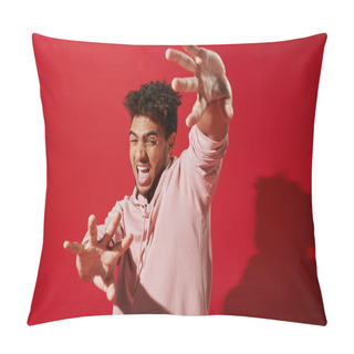 Personality  Anxious African American Man In Pink Hoodie Gesturing And Screaming On Red Background, Terrified Pillow Covers