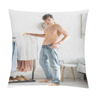 Personality  Handsome Man With Bare Torso Standing Near Clothes Rack And Holding Shirt In Bedroom Pillow Covers