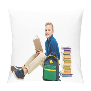 Personality  Cheerful Schoolboy Holding Opened Book, Looking At Camera And Sitting Near Backpack Isolated On White Pillow Covers