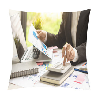 Personality  A Businessman Pressing His Finger On A Calculator To Calculate Expenses Finance Is Calculating Tax Information. And Analyze Financial Stock Charts That Are In Good Shape With Growth And Progress. Pillow Covers