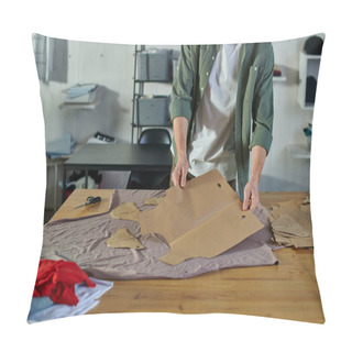 Personality  Cropped View Of Young Artisan Holding Sewing Pattern Near Fabric And Scissors On Table In Blurred Print Studio, Multitasking Business Owner Managing Multiple Project Pillow Covers