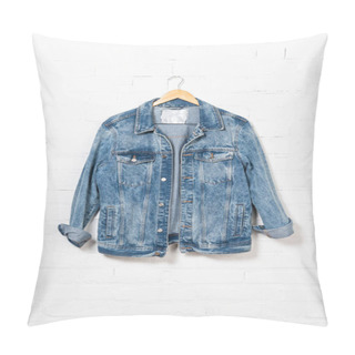 Personality  Denim Jacket Hanging On Hanger Near White Brick Wall Pillow Covers
