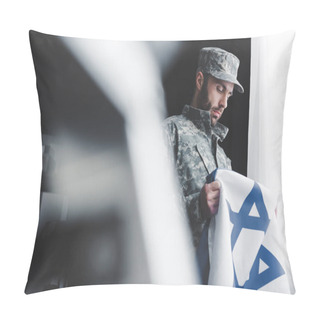 Personality  Selective Focus Of Pensive Bearded Man In Military Uniform Holding Israel National Flag While Standing By Window Pillow Covers