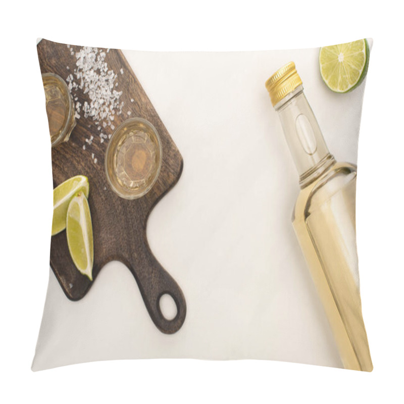 Personality  top view of golden tequila with lime, salt on wooden cutting board on white marble surface pillow covers