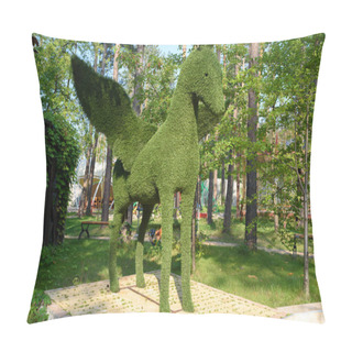 Personality  Figure Of Pegasus Made Of Green Lawn Grass In The Park, Free Space. Green Grass Covered Topiary Pegasus, Landscape Design. Grass Figure Of Pegasus, Topiary Figure Pillow Covers