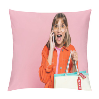 Personality  Shocked Woman Looking At Camera While Holding Purchases With Sale Word On Price Tags And Talking On Smartphone On Pink Background Pillow Covers