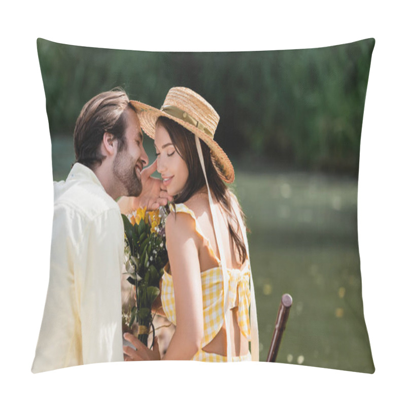 Personality  happy young woman in straw hat holding bouquet of flowers near romantic boyfriend on lake pillow covers