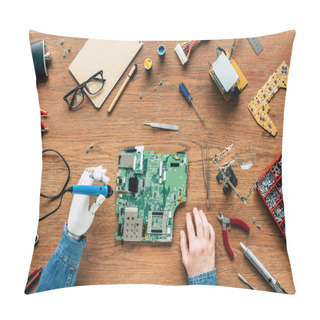 Personality  Cropped Image Of Electronic Engineer With Robotic Hand Fixing Motherboard By Soldering Iron At Table Surrounded By Tools Pillow Covers