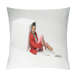 Personality  Positive African American Woman In Modern And Vibrant Clothes Sitting Near Cube On Grey Backdrop Pillow Covers