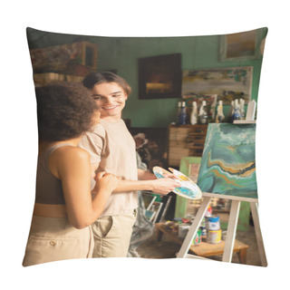 Personality  Happy Young Artist With Palette Looking At African American Girlfriend Near Painting On Easel Pillow Covers