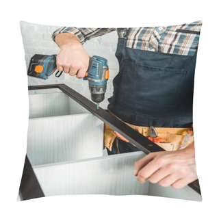 Personality  Cropped View Of Installer Holding Hammer Drill While Installing Rack  Pillow Covers