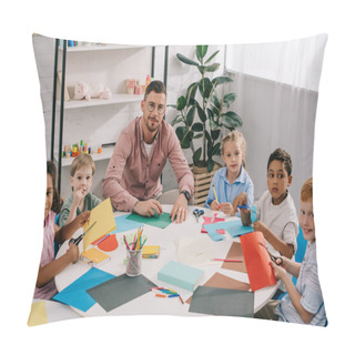 Personality  Male Teacher And Multiracial Preschoolers Sitting At Table With Colorful Papers In Classroom Pillow Covers