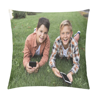 Personality  Two Cheerful Brothers Lying On Grass, Holding Smartphones And Looking At Camera Pillow Covers