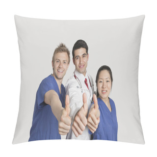 Personality  Portrait Of A Happy Medical Team Gesturing Thumbs Up Over Gray Background Pillow Covers