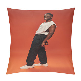 Personality  Carefree African American Man In Black Pants And White Tank Top Posing On Red And Orange Backdrop Pillow Covers