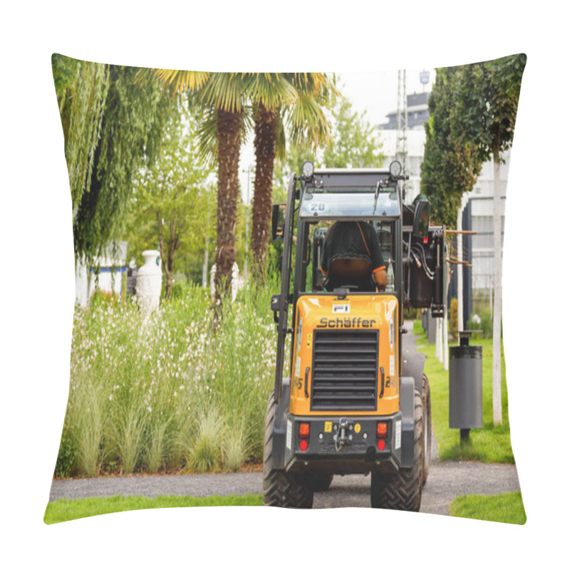 Personality  Heilbronn, Germany - August 12, 2019. A Small Tractor Cleans The Area Near Modern Houses Duringduring The Federal Garden Show 2019 BUGA Heilbronn. Pillow Covers