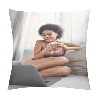 Personality  African American Woman In Lingerie Sitting On Sofa And Holding Cup While Watching Movie On Laptop Pillow Covers