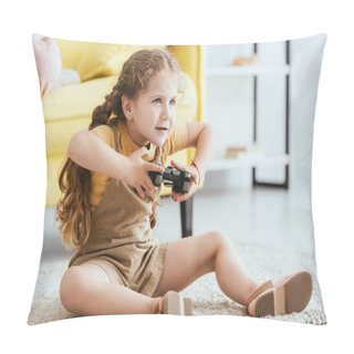 Personality  KYIV, UKRAINE - JUNE 19, 2020: Adorable, Focused Child Playing Video Game While Sitting On Floor Pillow Covers