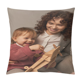 Personality  Successful Mother, Balancing Work And Life Concept, Happy Businesswoman In Suit Sitting On Armchair And Playing With Toddler Daughter, Wooden Biplane, Grey Background, Engaging With Child  Pillow Covers