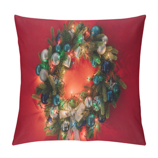 Personality  Top View Of Christmas Wreath Decorated With Toys And Lights On Red Background Pillow Covers