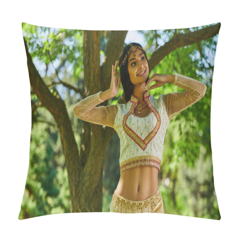 Personality  elegant indian woman in traditional clothes smiling and looking away in green park, summer leisure pillow covers