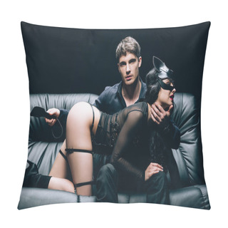 Personality  Passionate Man Sitting With Leather Spanking Paddle Near Sexy Woman In Bdsm Costume On Leather Sofa Isolated On Black Pillow Covers